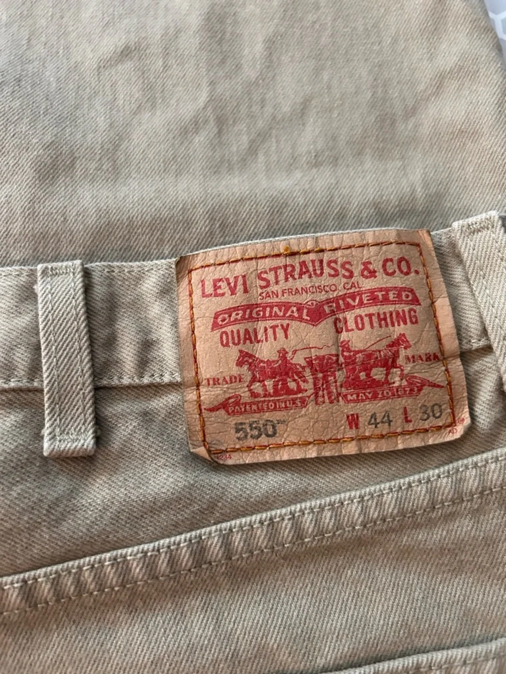 Levi's relaxed fit 550 jeans in khaki tan.  Size 44X30. Cotton